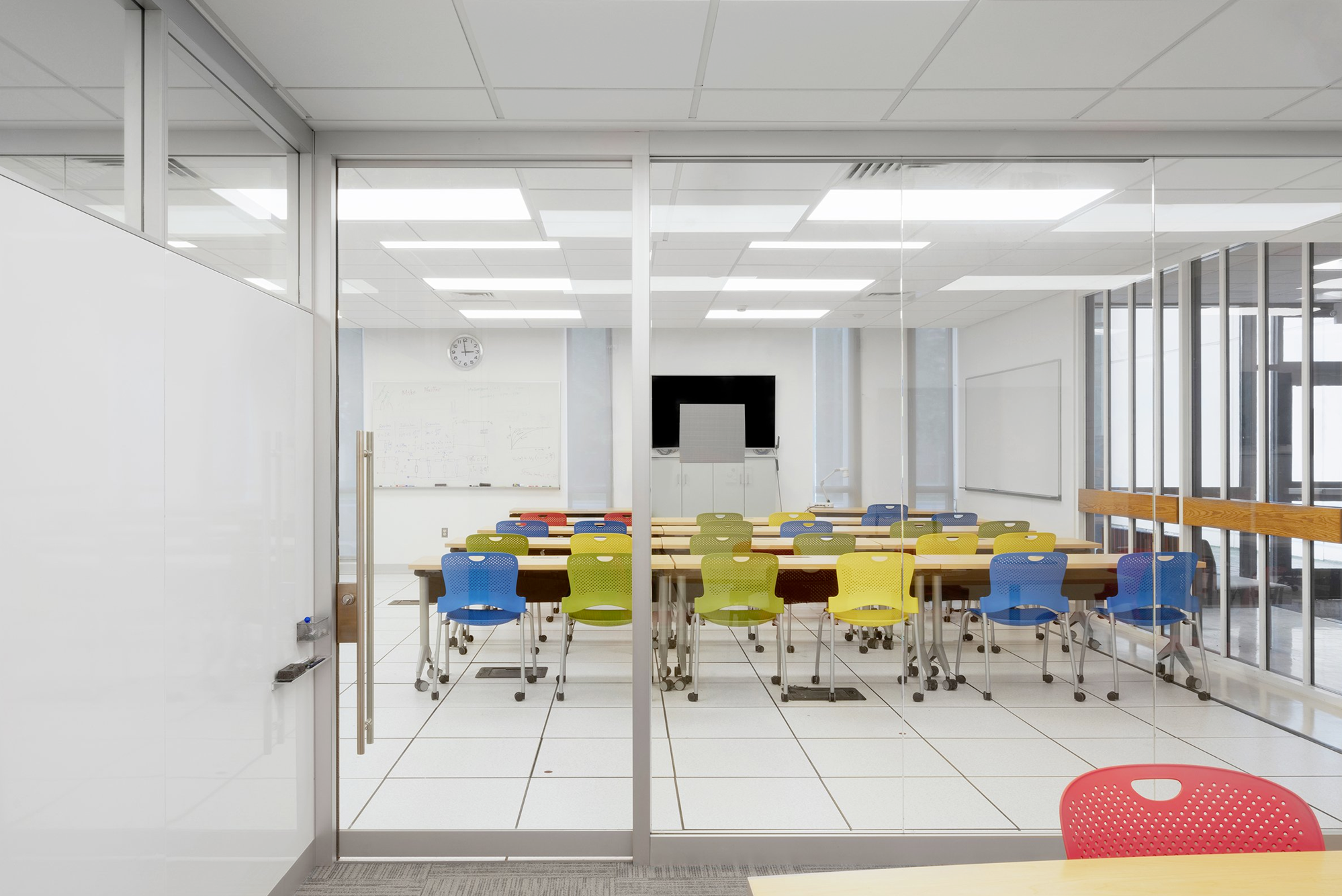 Interior, Lederle Maker Space at UMass Amherst, classroom space, desks, chairs, whiteboard, monitor