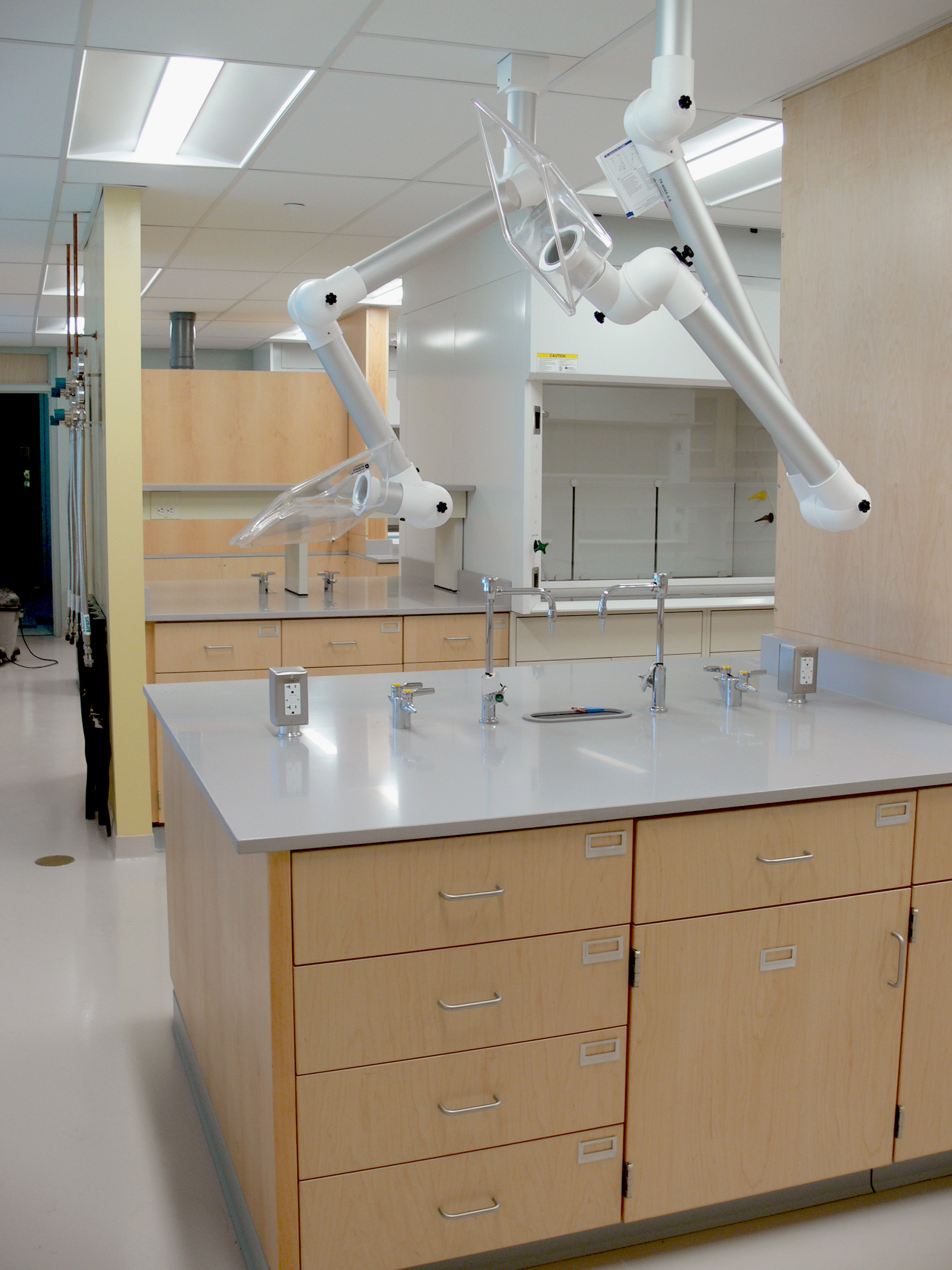 Interior, Olney Research Laboratory at UMass Lowell, workstations, fume hood, ceiling mounted lab fume hood exhaust, storage