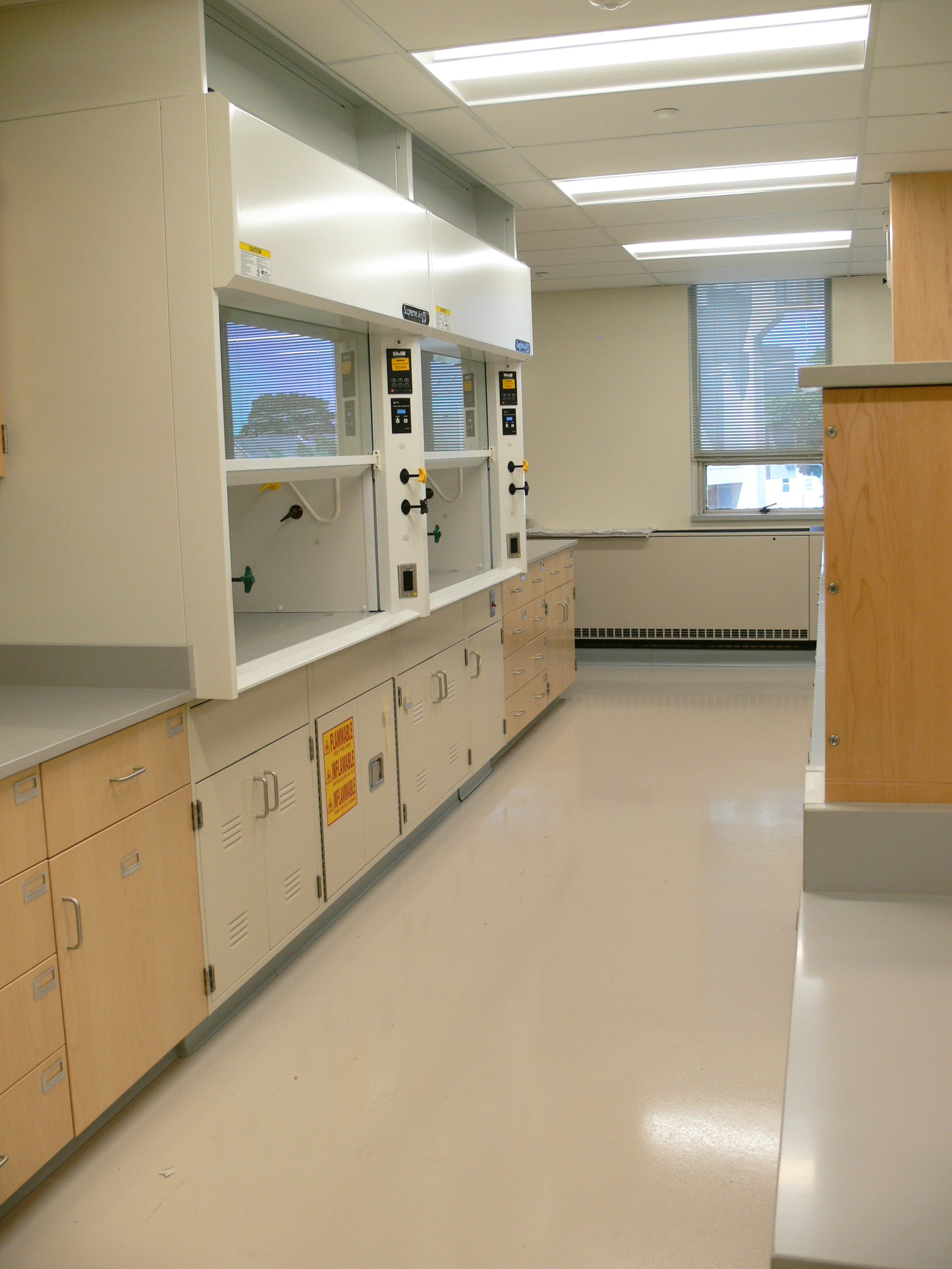 Interior, Olney Research Laboratory at UMass Lowell, workstations, fume hood, storage