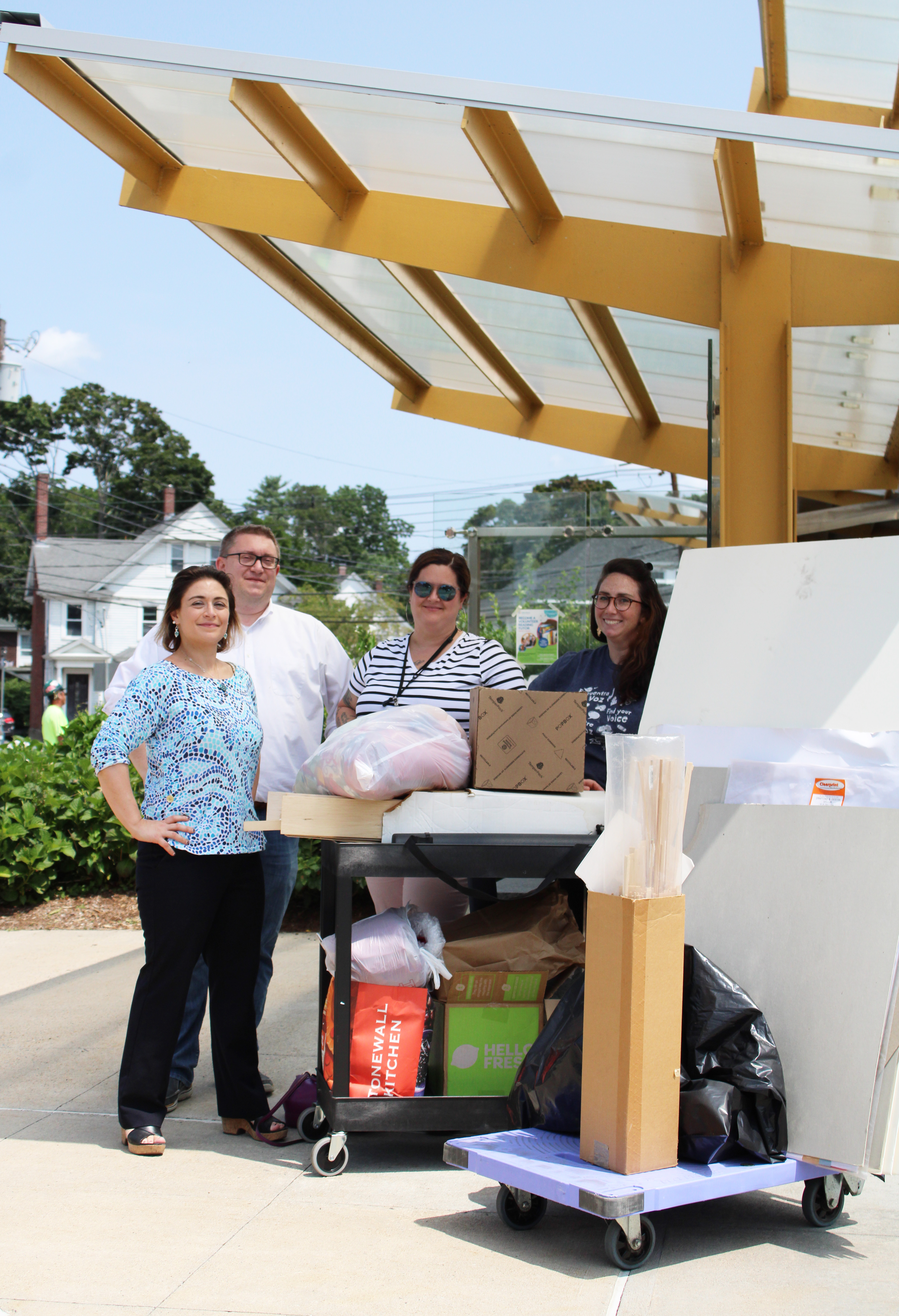 Photo from left to right: Diana Cioffari-MacPhee (MCA Marketing Coordinator), John Matz (MCA Managing Principal), Dawn Dellasanta (FPL Assistant Director), Kelly Cashman (FPL Children's Services Specialist Makers/Crafts) standing outside the Framingham Public Library with the donated makerspace materials