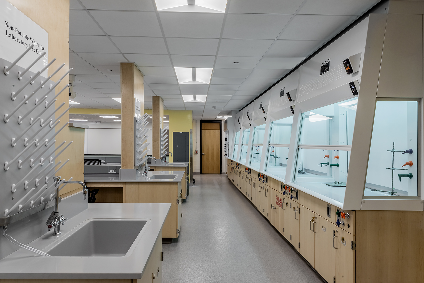 Interior, Organic Chemistry Teaching Suite at UMass Lowell, work stations, sinks, storage, fume hoods